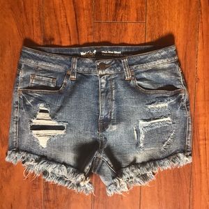 Distressed mid rise denim shorts